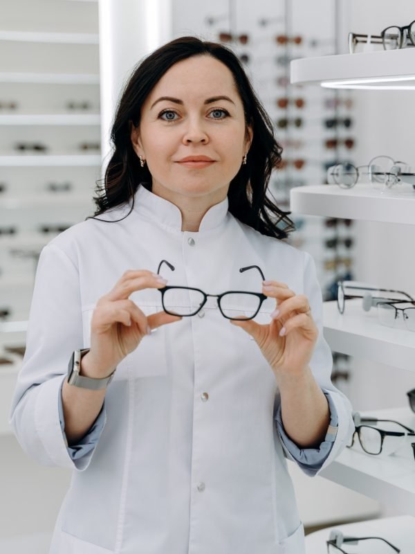 handsome-ophthalmologist-holding-eyeglasses-for-a-try-out-.jpg